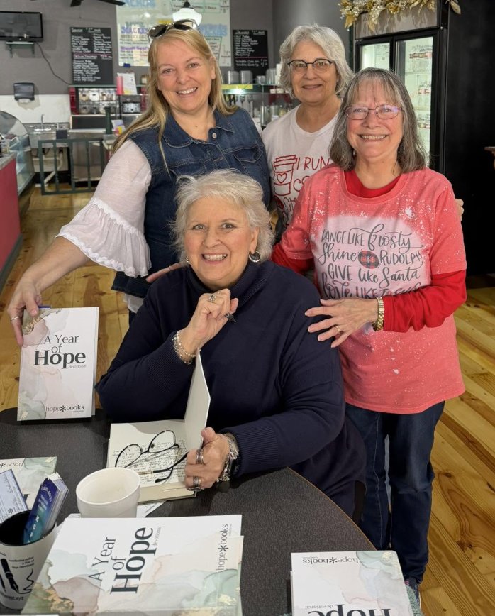A reader holding A Year of Hope