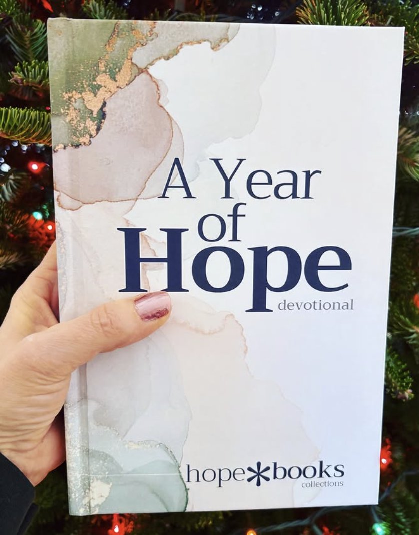 A reader holding A Year of Hope